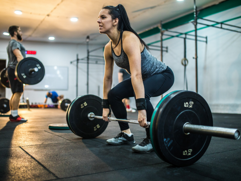 image showing a woman doing deadlifts